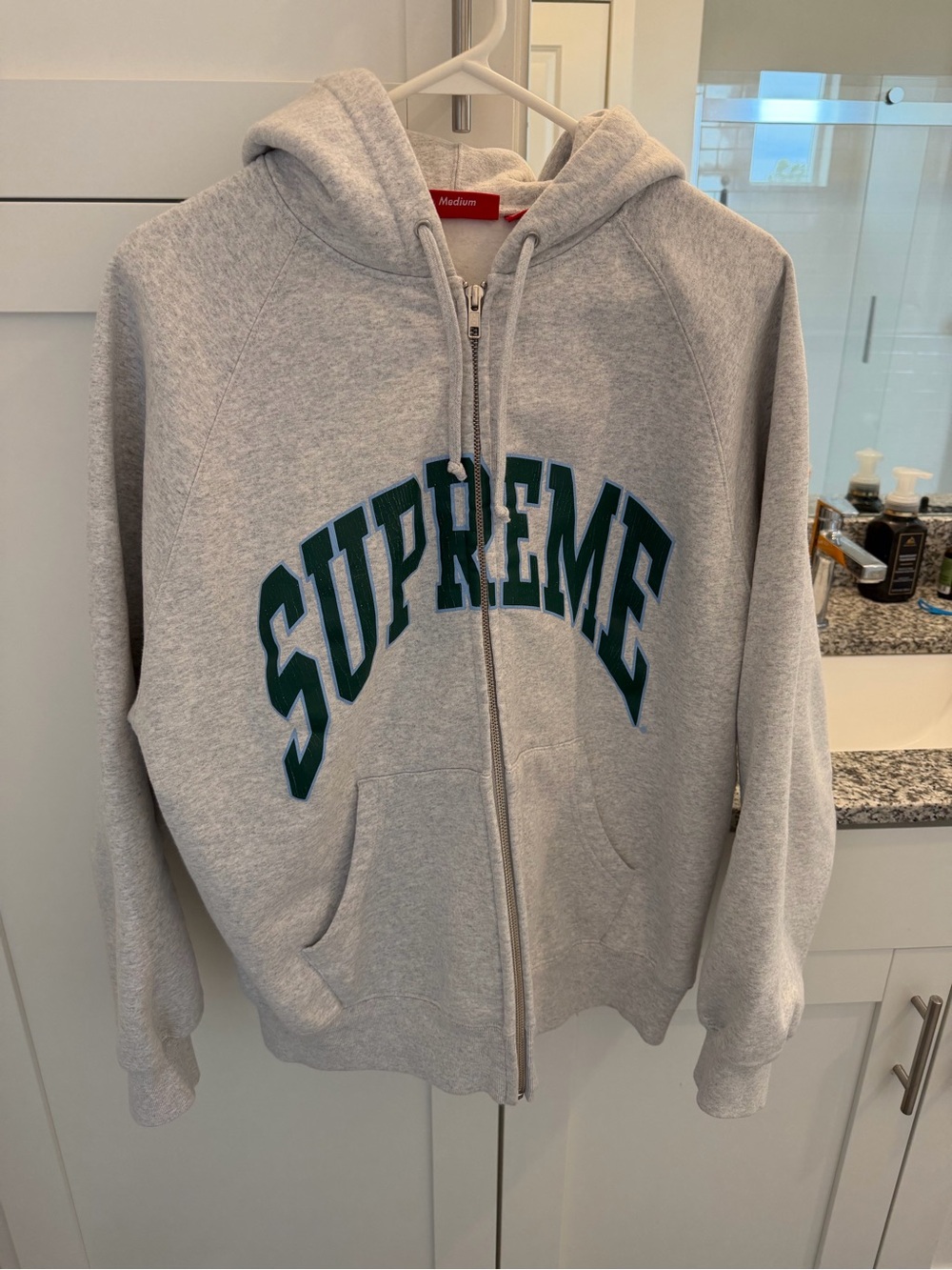 Supreme Grey Hoodie with Red Tag